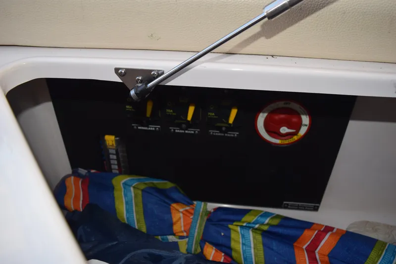 Slide: The Image of 2021 Regal 26 XO boat interior showing control panel and colorful fabric. - 195