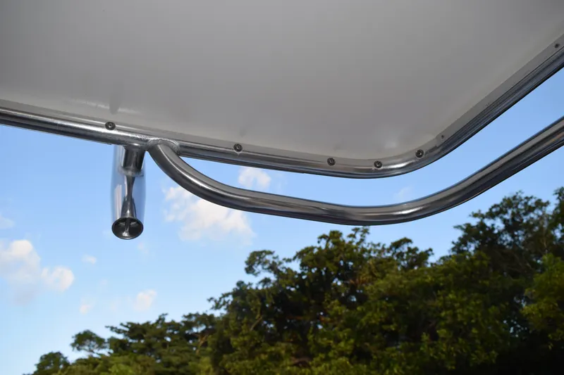 Slide: The Image of 2021 Regal 26 XO boat canopy detail with blue sky and trees in background. - 201