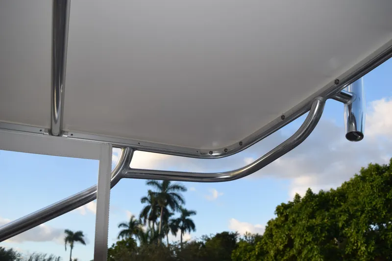 Slide: The Image of 2021 Regal 26 XO boat canopy with stainless steel frame against a blue sky. - 204