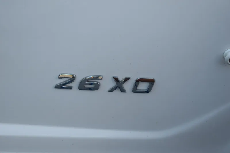 Slide: The Image of Regal 26 XO 2021 model emblem on a sleek white surface. - 208