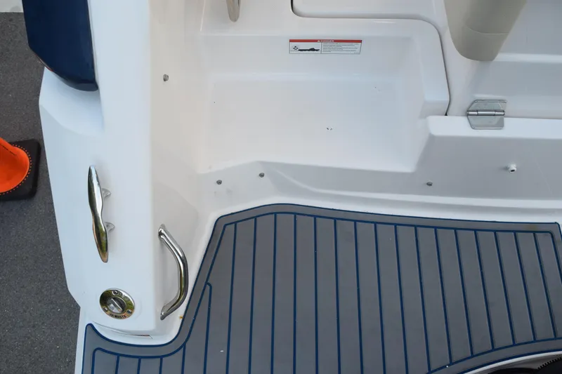 Slide: The Image of 2021 Regal 26 XO boat deck with stainless steel handles and non-slip flooring. - 209