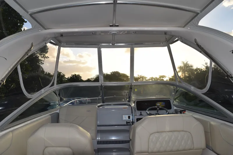 Slide: The Image of Interior view of 2021 Regal 26 XO boat with seating and steering wheel. - 215