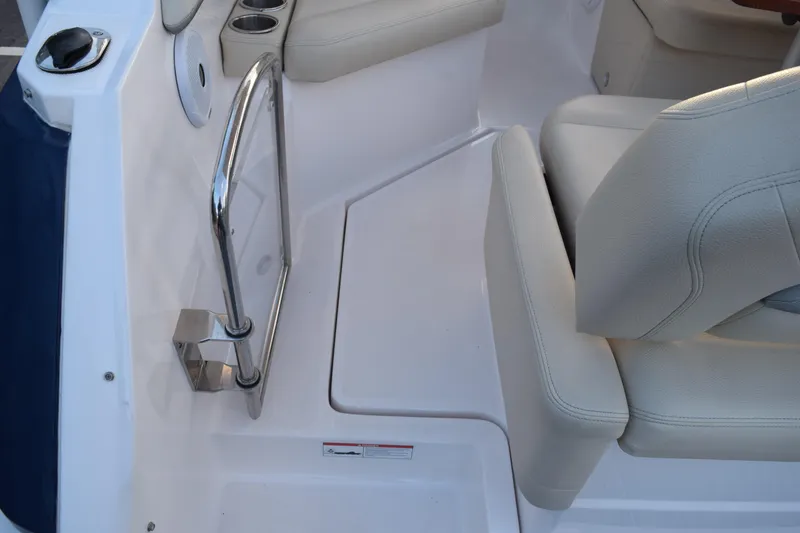 Slide: The Image of Interior of 2021 Regal 26 XO boat, featuring seating and stainless steel railing. - 221