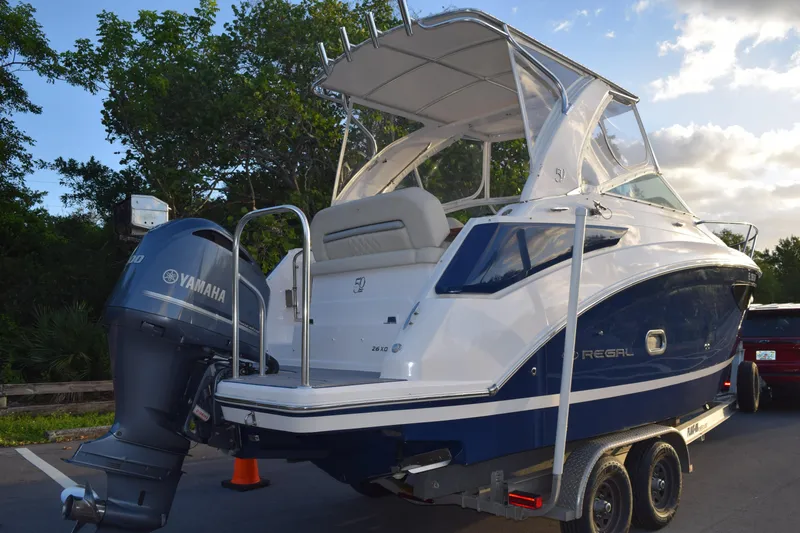 Slide: The Image of 2021 Regal 26 XO boat with Yamaha engine on trailer, parked outdoors. - 224