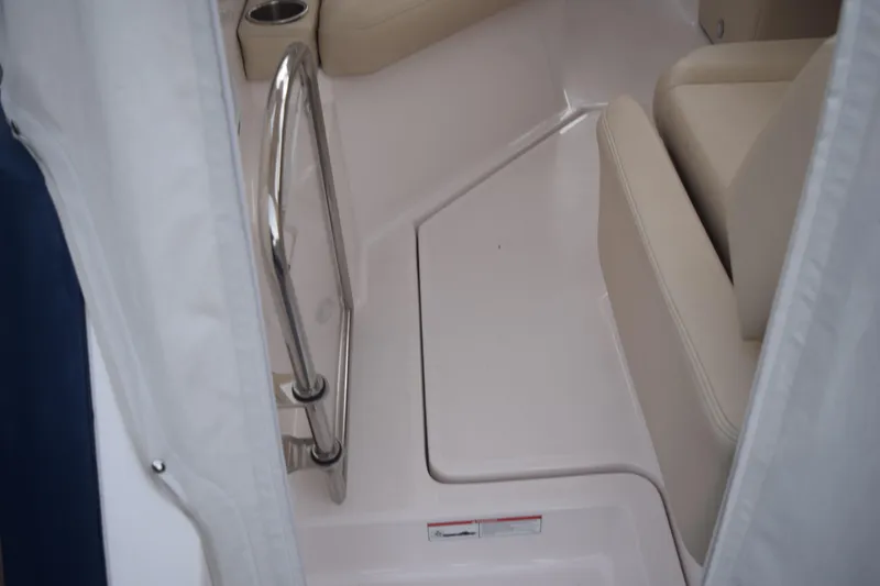 Slide: The Image of Interior of 2021 Regal 26 XO boat with beige seating and stainless steel railing. - 28