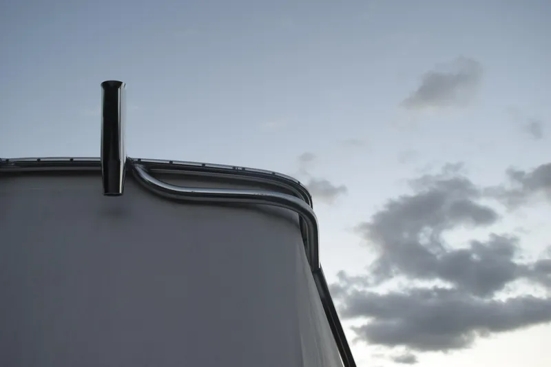 Slide: The Image of 2021 Regal 26 XO boat railing against cloudy sky backdrop. - 30