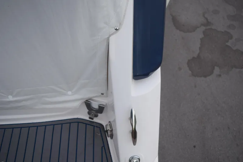 Slide: The Image of 2021 Regal 26 XO boat deck with white and blue detailing. - 33