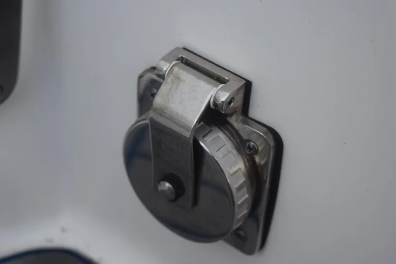 Slide: The Image of Close-up of a 2021 Regal 26 XO boat's metal fuel cap. - 39