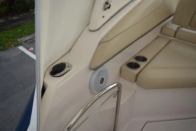 Slide: The Image of 2021 Regal 26 XO boat interior with beige seating and cup holders. - 41