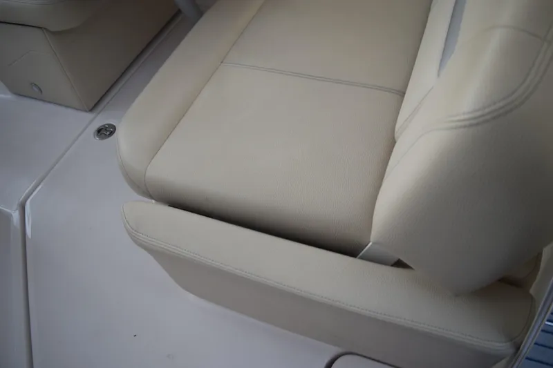 Slide: The Image of Beige leather seating on 2021 Regal 26 XO boat interior. - 52