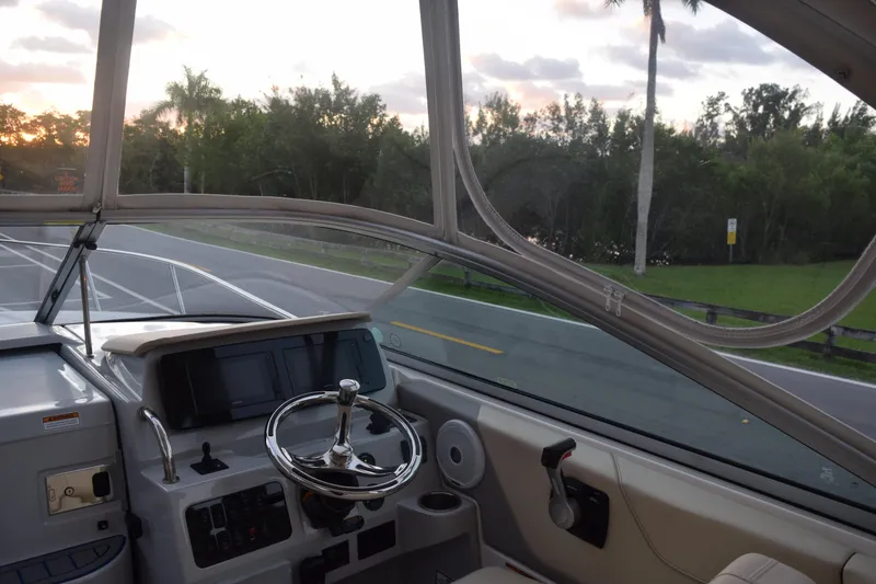 Slide: The Image of Interior view of 2021 Regal 26 XO boat cockpit with steering wheel and dashboard. - 84