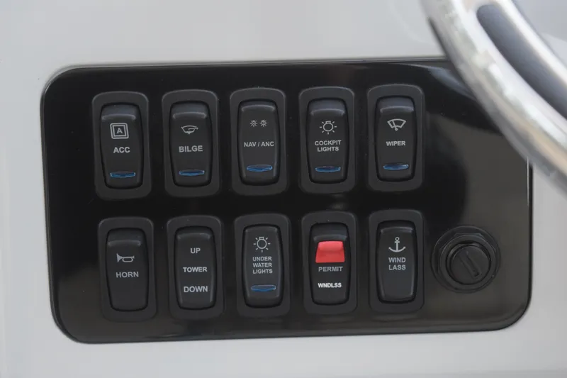 Slide: The Image of Control panel of 2021 Regal 26 XO boat with various switches and functions. - 86