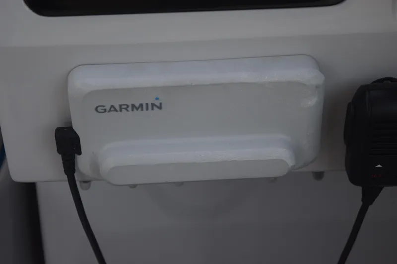 Slide: The Image of Garmin device installed on 2021 Regal 26 XO boat dashboard. - 87
