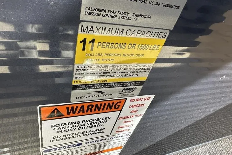Slide: The Image of 2014 Bennington 24 SPDX capacity label, 11 persons or 1500 lbs, safety warnings. - 19