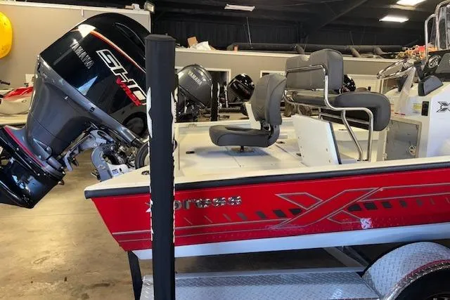 Slide: The Image of 2026 Xpress H22B Bay boat with Yamaha engine in showroom. - 10