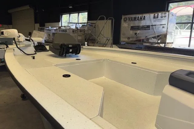 Slide: The Image of 2026 Xpress H22B Bay boat interior with Yamaha equipment in showroom. - 13