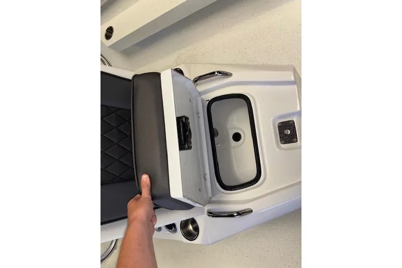 Slide: The Image of 2026 Xpress H22B Bay boat seat with storage compartment and cup holders. - 21
