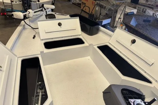Slide: The Image of 2026 Xpress H22B Bay boat interior with open storage compartments. - 23