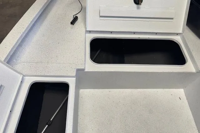 Slide: The Image of 2026 Xpress H22B Bay boat interior with open storage compartments. - 24