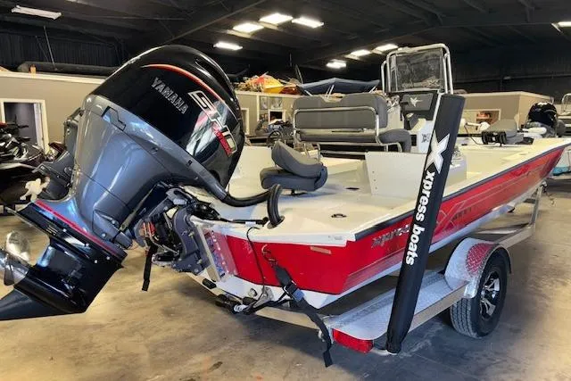 Slide: The Image of 2026 Xpress H22B Bay boat with Yamaha engine in a showroom. - 6