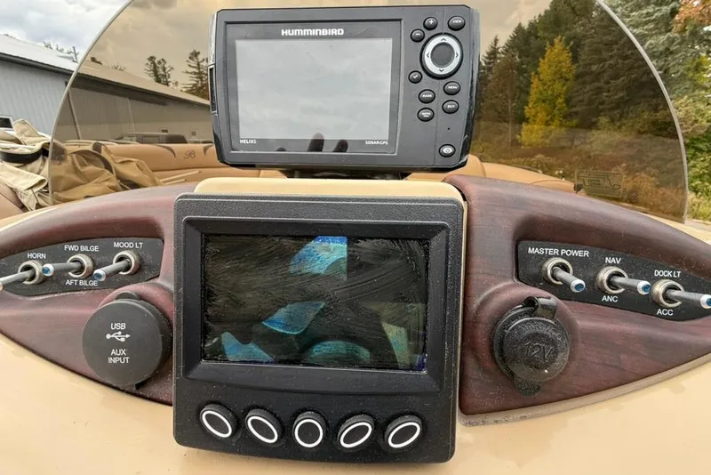 Slide: The Image of Control panel of a 2016 Berkshire 230CL STS boat with navigation equipment. - 10