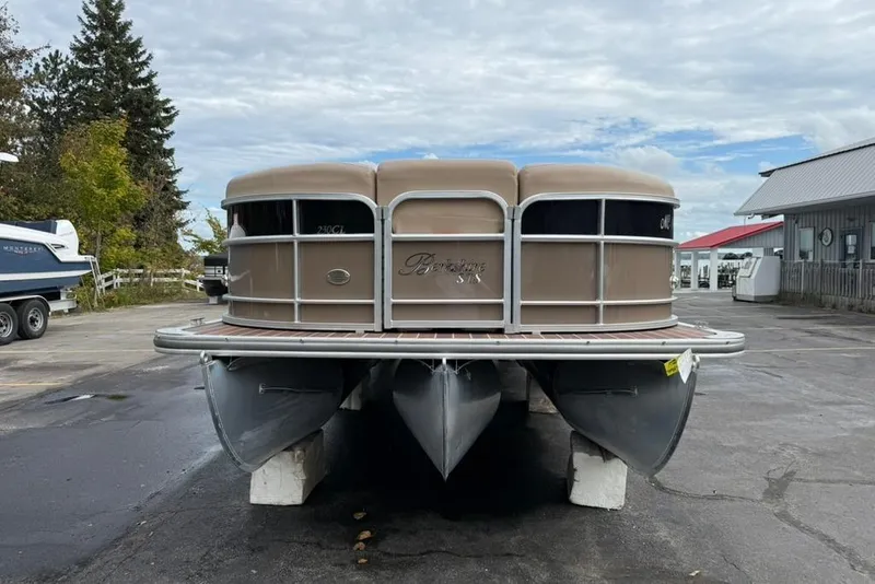 Slide: The Image of 2016 Berkshire 230CL STS pontoon boat on a dry dock, outdoor setting. - 3