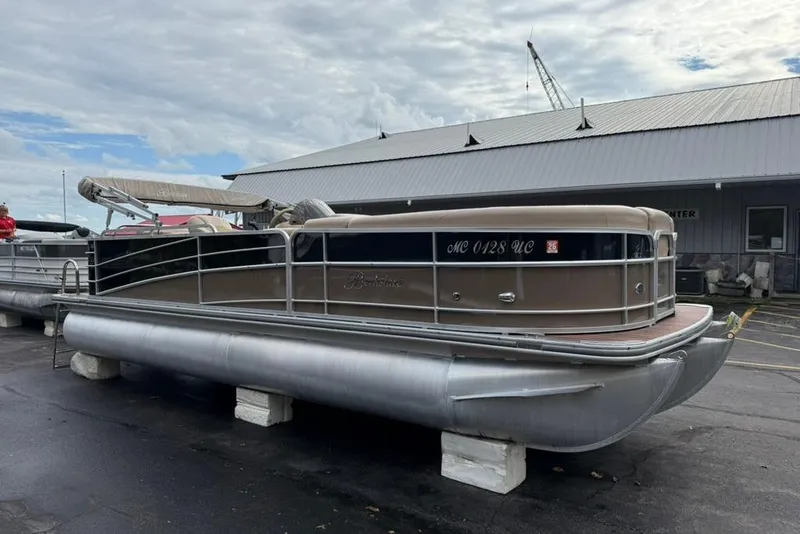 Slide: The Image of 2016 Berkshire 230CL STS pontoon boat on display outdoors. - 4