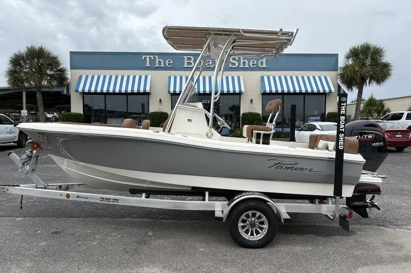 The Image of 2026 Pioneer Islander 180 boat on trailer outside The Boat Shed dealership. - 1