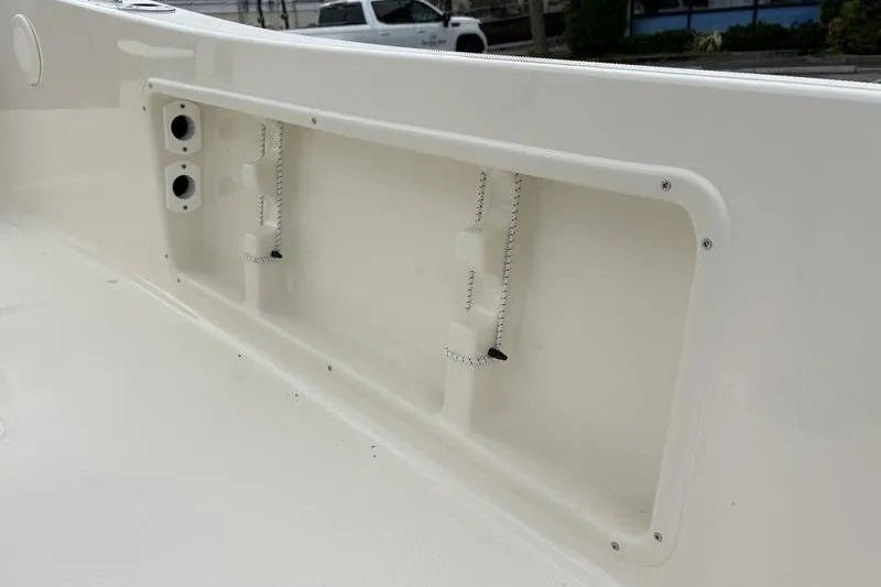 Slide: The Image of 2026 Pioneer Islander 180 boat interior detail with storage compartment. - 18
