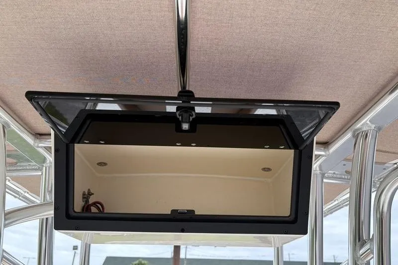 Slide: The Image of Open storage compartment on 2026 Pioneer Islander 180 boat, showcasing interior design. - 21