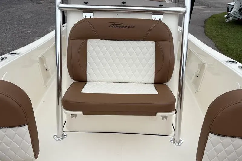Slide: The Image of 2026 Pioneer Islander 180 boat seat with brown and white diamond-pattern upholstery. - 24