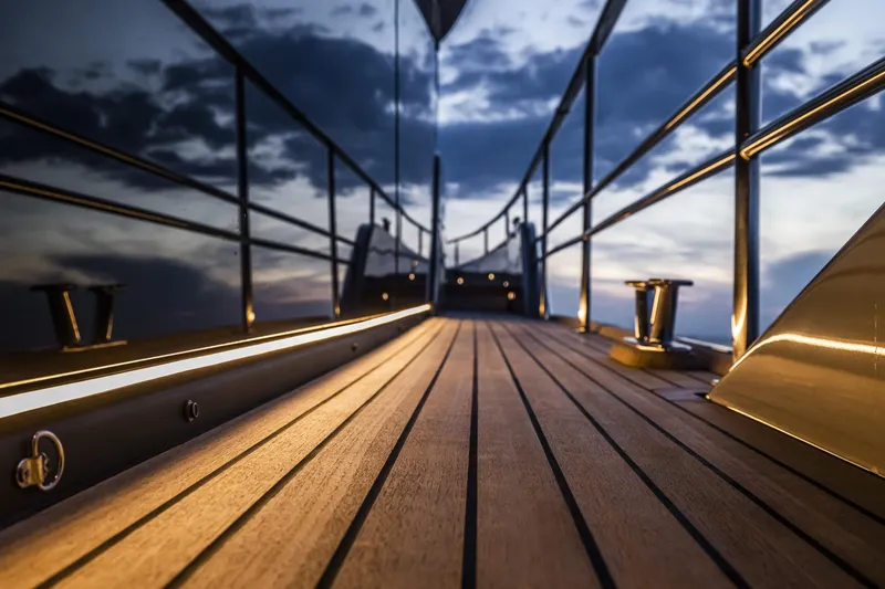 Slide: The Image of Luxurious Cranchi Sessantasette 67 yacht deck at sunset, 2026 model. - 13