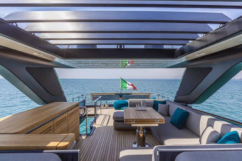 Slide: The Image of Luxurious 2026 Cranchi Sessantasette 67 yacht deck with elegant seating and ocean view. - 16