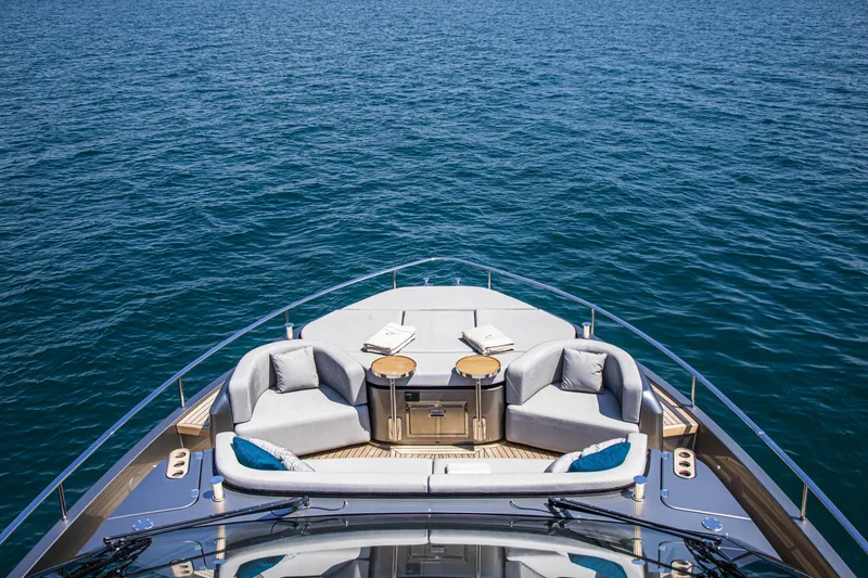 Slide: The Image of Luxurious 2026 Cranchi Sessantasette 67 yacht deck with elegant seating and ocean view. - 17