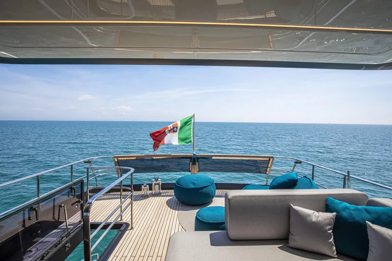 Slide: The Image of Luxurious 2026 Cranchi Sessantasette 67 yacht deck with ocean view and comfortable seating. - 18