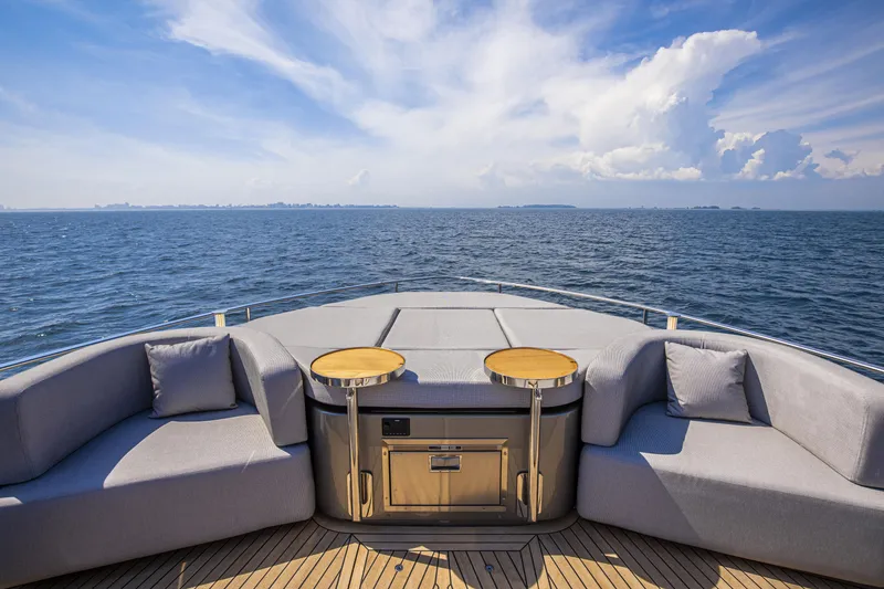 Slide: The Image of Luxurious 2026 Cranchi Sessantasette 67 yacht deck with ocean view and elegant seating. - 23
