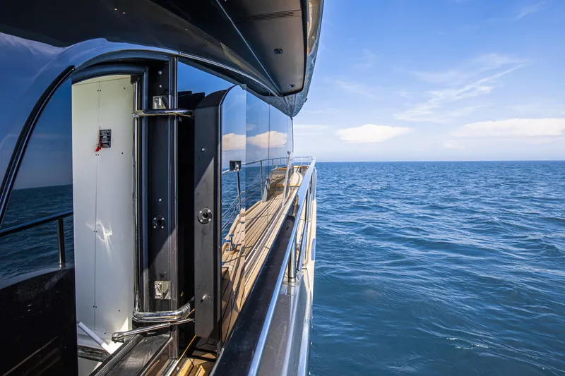 Slide: The Image of 2026 Cranchi Sessantasette 67 yacht deck with ocean view and sleek design. - 30