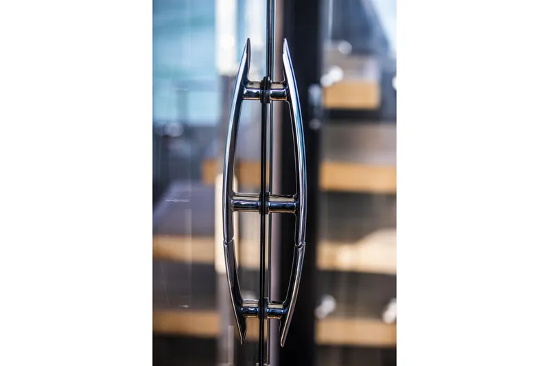 Slide: The Image of Close-up of a sleek chrome handle on the 2026 Cranchi Sessantasette 67 yacht. - 33