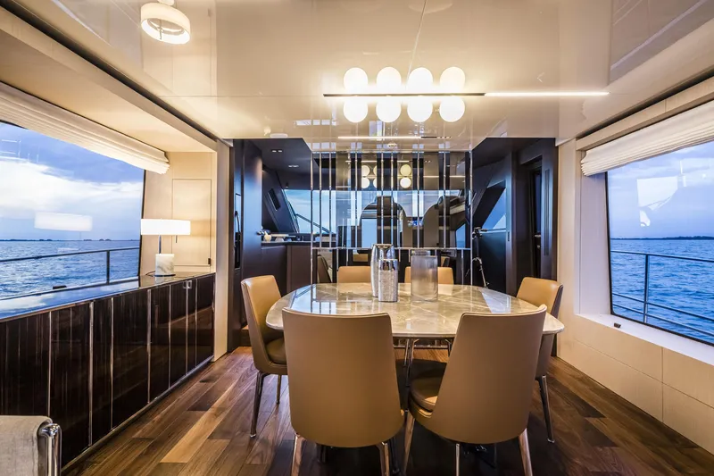 Slide: The Image of Luxurious interior of 2026 Cranchi Sessantasette 67 yacht with elegant dining area and ocean view. - 39