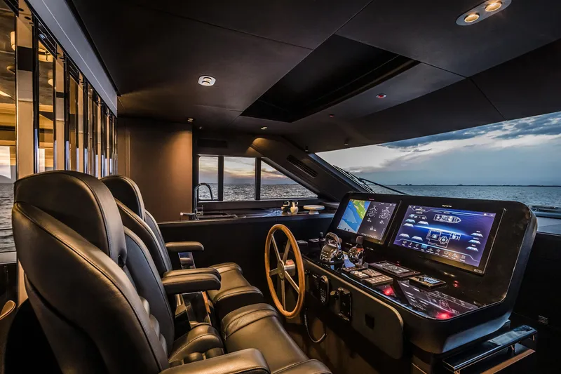 Slide: The Image of Luxurious 2026 Cranchi Sessantasette 67 yacht cockpit with modern navigation systems at sunset. - 40