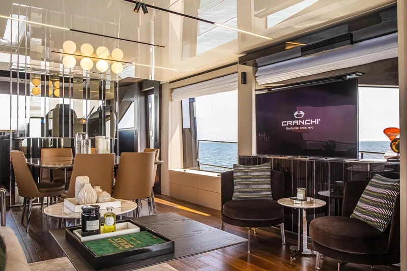 Slide: The Image of Luxurious interior of 2026 Cranchi Sessantasette 67 yacht with elegant seating and sea view. - 48