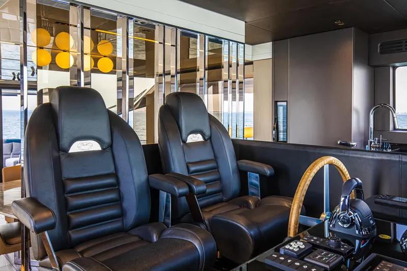 Slide: The Image of Luxurious helm of 2026 Cranchi Sessantasette 67 yacht with leather seats and modern controls. - 50