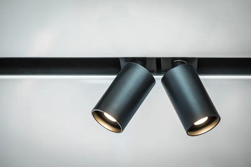 Slide: The Image of Modern black ceiling spotlights illuminating a room, sleek and contemporary design. - 58
