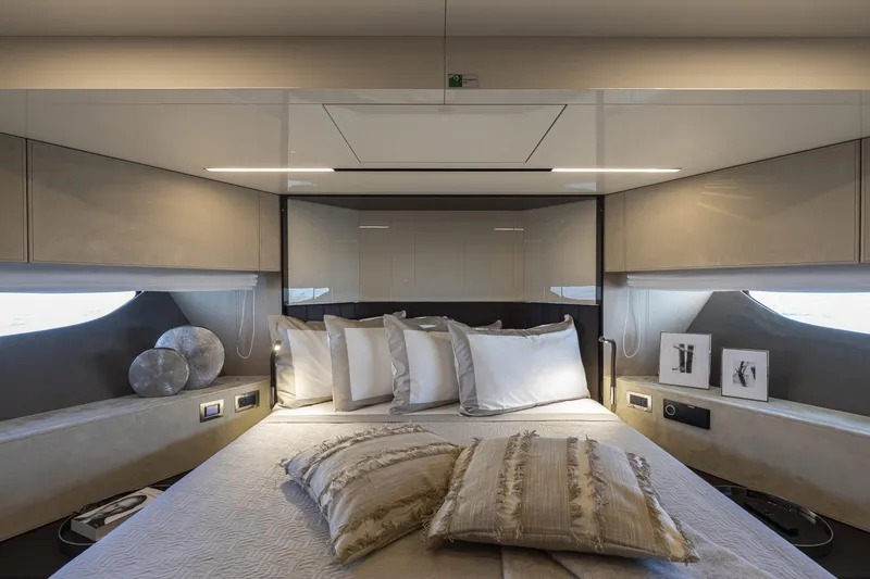 Slide: The Image of Luxurious bedroom interior of 2026 Cranchi Sessantasette 67 yacht with elegant decor and plush bedding. - 59