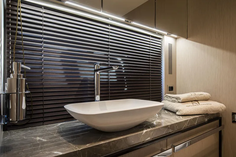 Slide: The Image of Luxurious bathroom in 2026 Cranchi Sessantasette 67 yacht with modern sink and elegant decor. - 61
