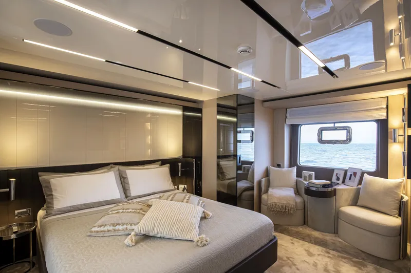 Slide: The Image of Luxurious bedroom interior of 2026 Cranchi Sessantasette 67 yacht with ocean view. - 65