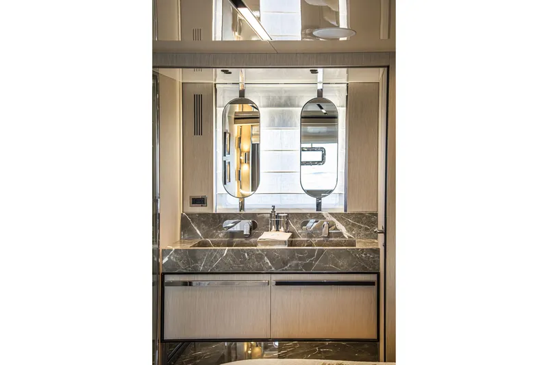 Slide: The Image of Luxurious bathroom interior of 2026 Cranchi Sessantasette 67 yacht with marble sink and modern design. - 67