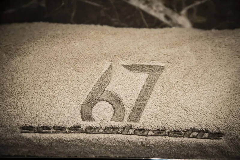 Slide: The Image of Cranchi Sessantasette 67 logo embossed on a textured surface, 2026 model. - 69