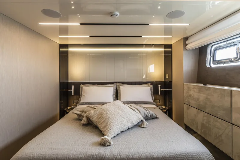 Slide: The Image of Luxurious bedroom interior of 2026 Cranchi Sessantasette 67 yacht, featuring elegant design and modern amenities. - 70