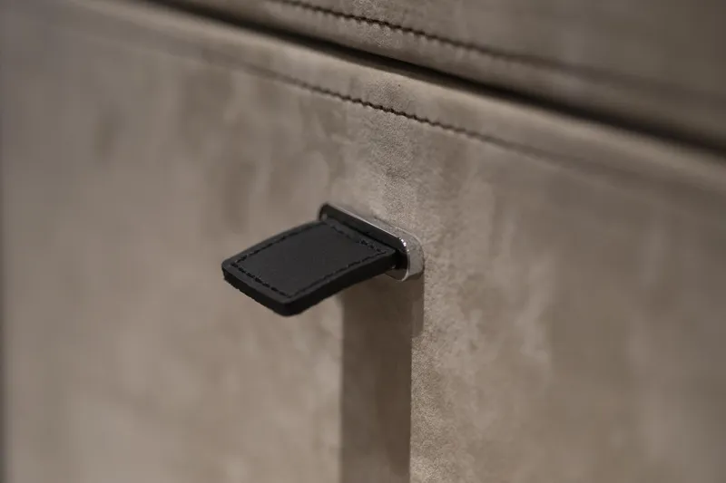 Slide: The Image of Close-up of a leather handle on the 2026 Cranchi Sessantasette 67 yacht interior. - 71